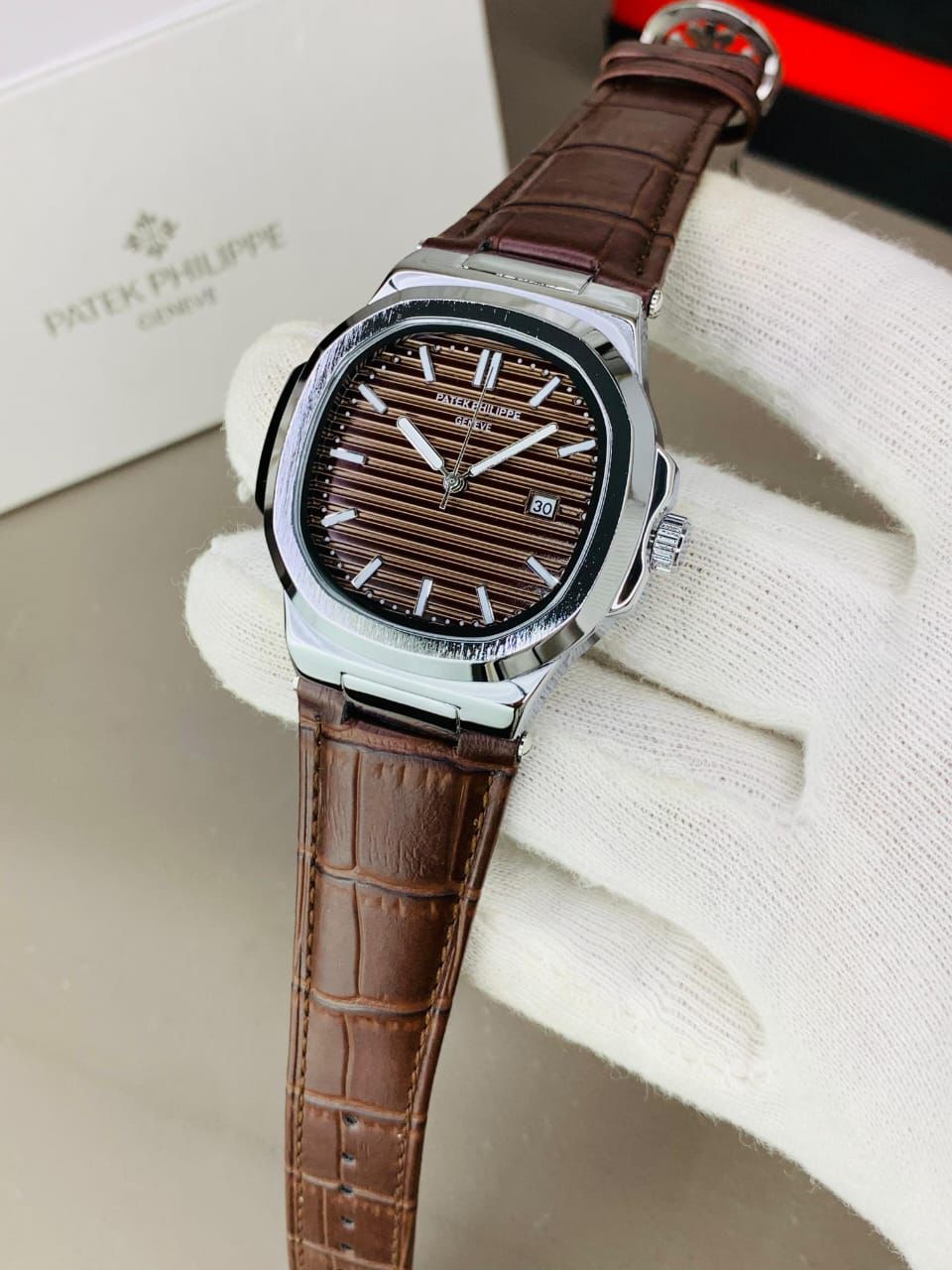 PATEK PHILIPPE GENEVE FAMOUS NATULIS MODEL WITH LEATHER STREP BRASS CASE WITH PATEK MONOGRAM LOCK