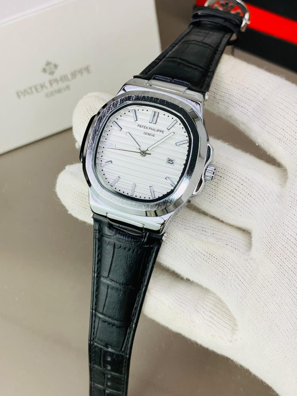 PATEK PHILIPPE GENEVE FAMOUS NATULIS MODEL WITH LEATHER STREP BRASS CASE WITH PATEK MONOGRAM LOCK
