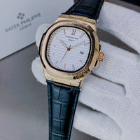 PATEK PHILIPPE GENEVE FAMOUS NATULIS MODEL WITH LEATHER STREP BRASS CASE WITH PATEK MONOGRAM LOCK