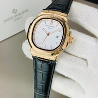 PATEK PHILIPPE GENEVE FAMOUS NATULIS MODEL WITH LEATHER STREP BRASS CASE WITH PATEK MONOGRAM LOCK